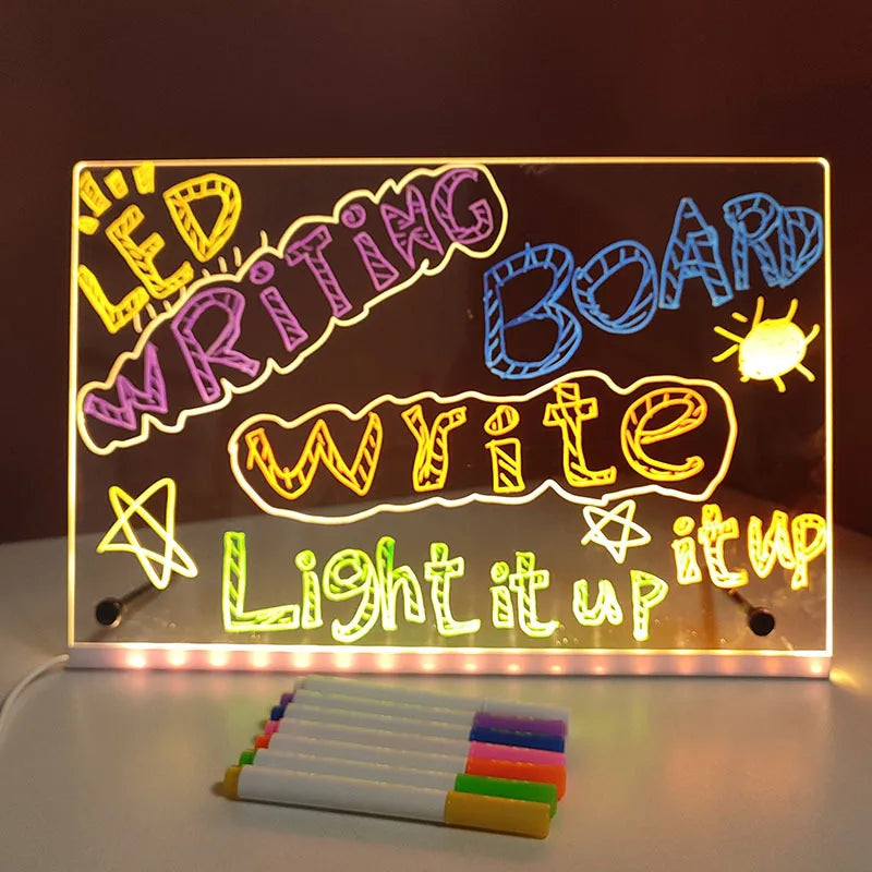 LED writing board with colorful text and markers on a dark background