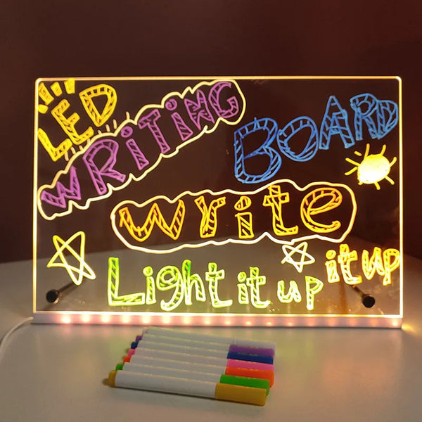LED writing board with colorful text and markers on a dark background